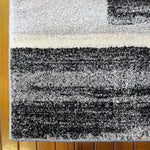 https://www.sarayrugs.com.au/wp-content/uploads/2018/04/Prestige-Tricolour-3443-Black-Corner.jpg