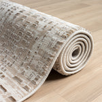 https://www.sarayrugs.com.au/wp-content/uploads/2023/08/Fable473Taupe_Roll.jpg